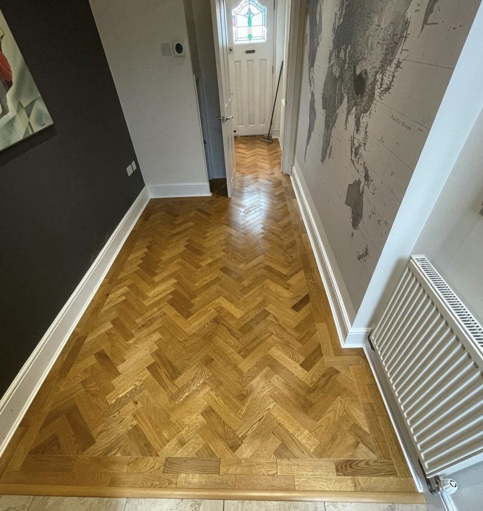 Smoked oak herringbone parquet installation. - Surrey Floor Restoration